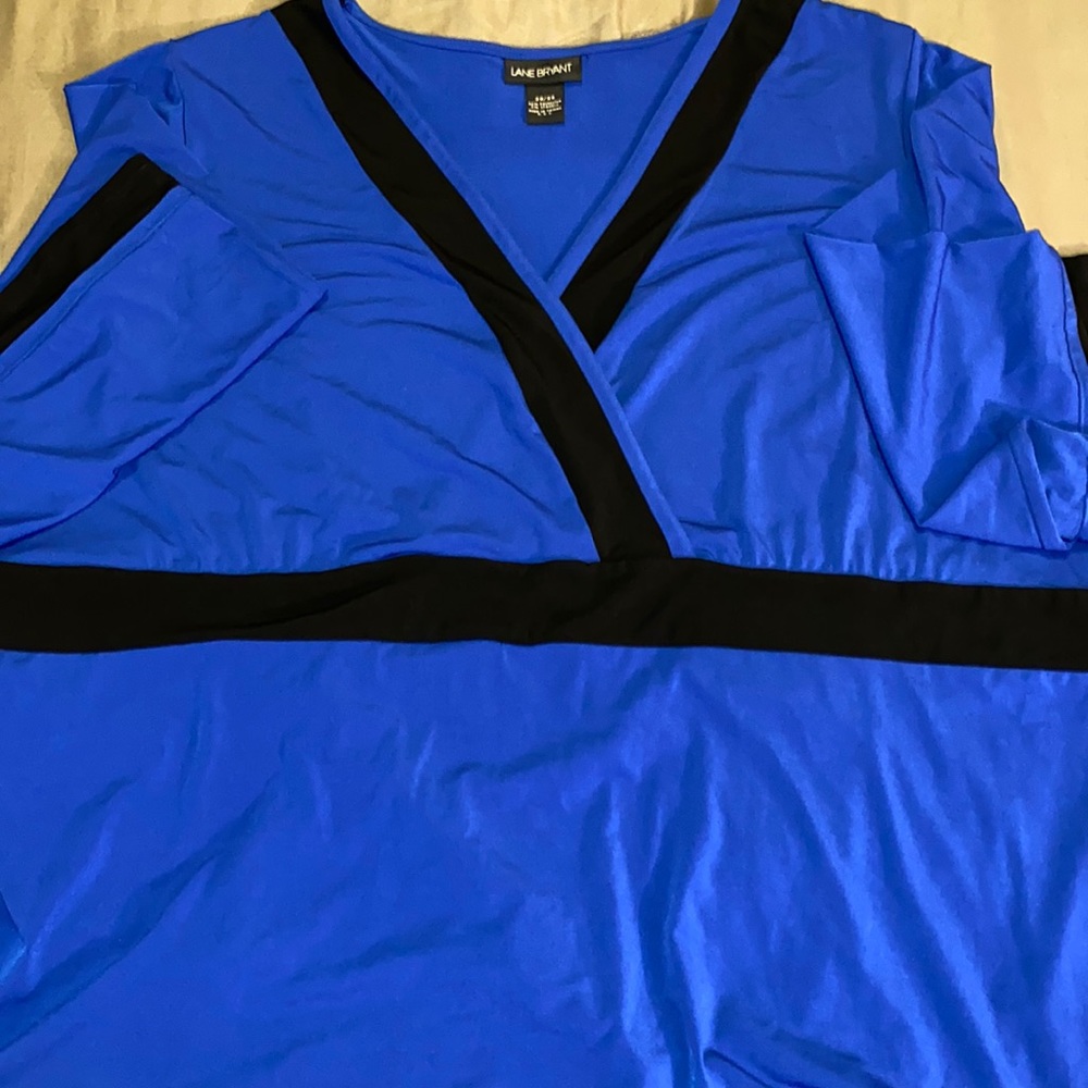 Blue blouse black trim on sleeves, midi, and v-torso